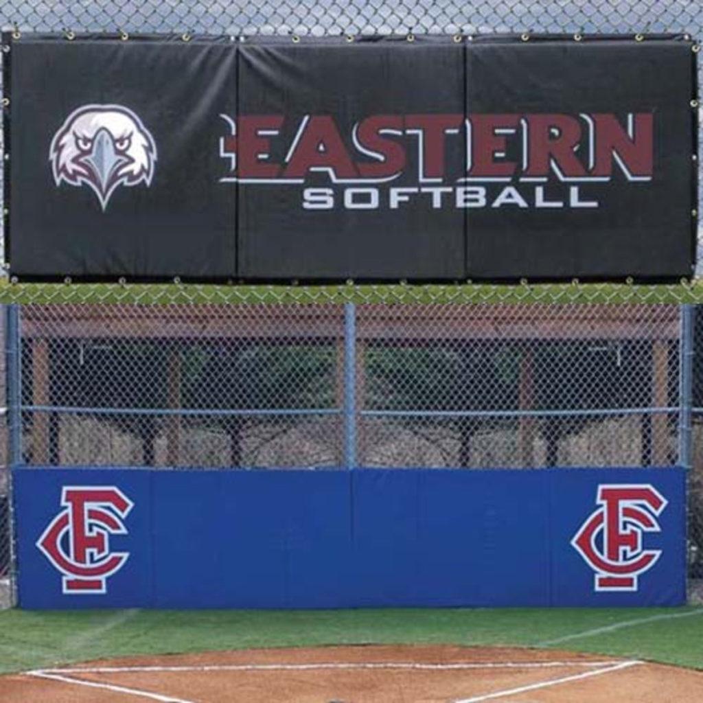  Backstop Padding with grommets attached to a baseball field fence